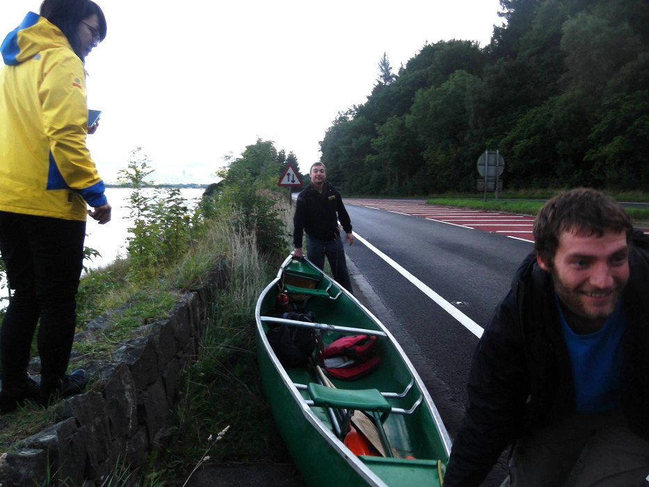 Woofers and Rob carrying a canoe