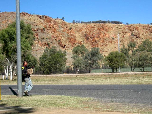 man hitchhiking in Australia